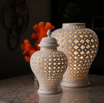 Pierced porcelain lanterns glowing on a marble table